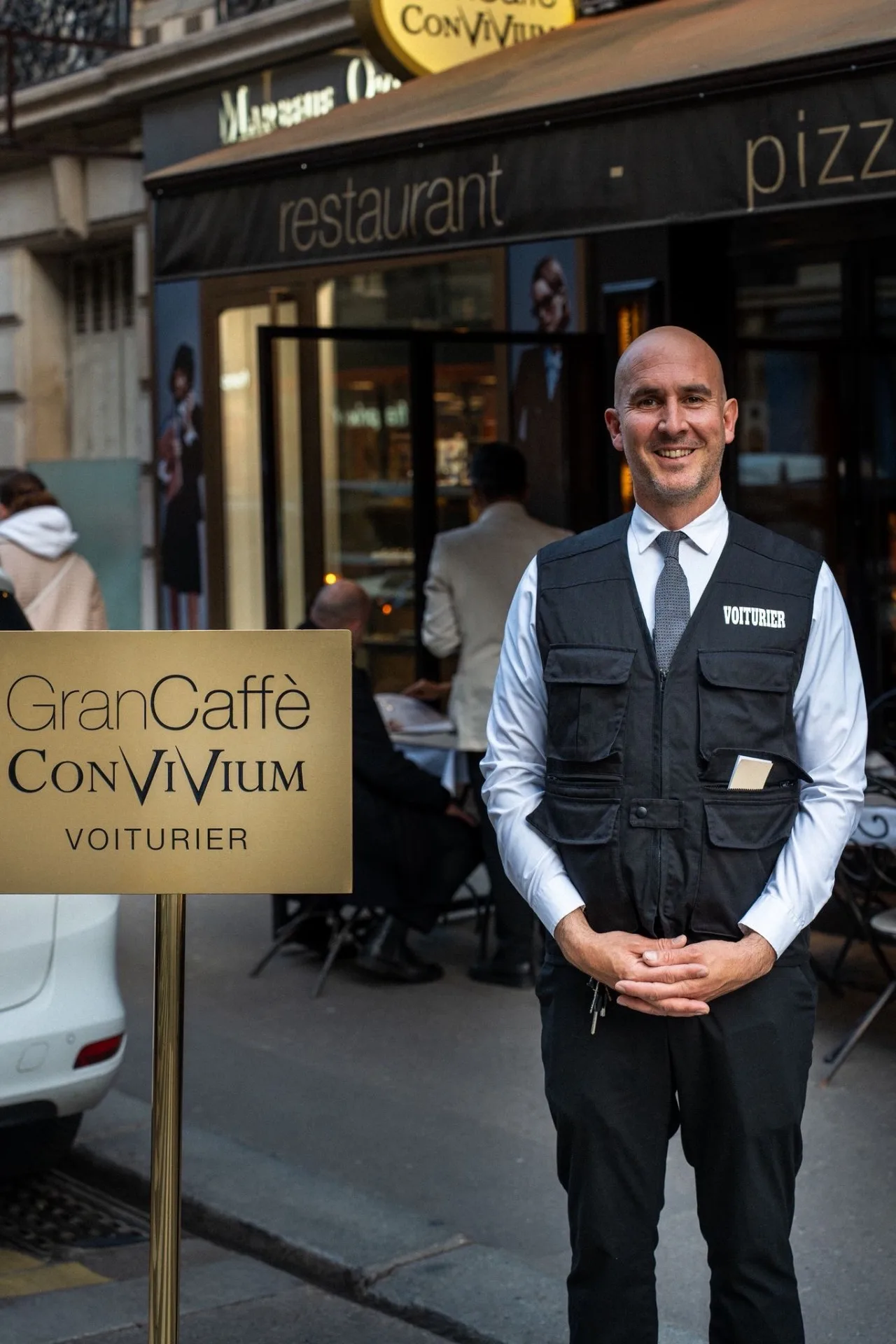 Gran Caffè Convivium valet in front of the restaurant on rue Marbeuf